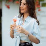 Portrait photo of a smiling woman with dark hair.